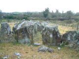 a series of boulder-like stones make up this tomb
