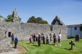 People stand in the priorary of Portumna castle.