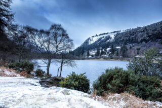 A snowy scene of the Glendalough valley