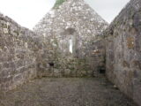an interior view of the inner walls and courtyard of the roofless church