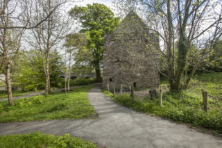 O'Doherty's Keep
Credit Photographic Archive, National Monuments Service, Government of Ireland walkway with a view of a stone castle through the trees
