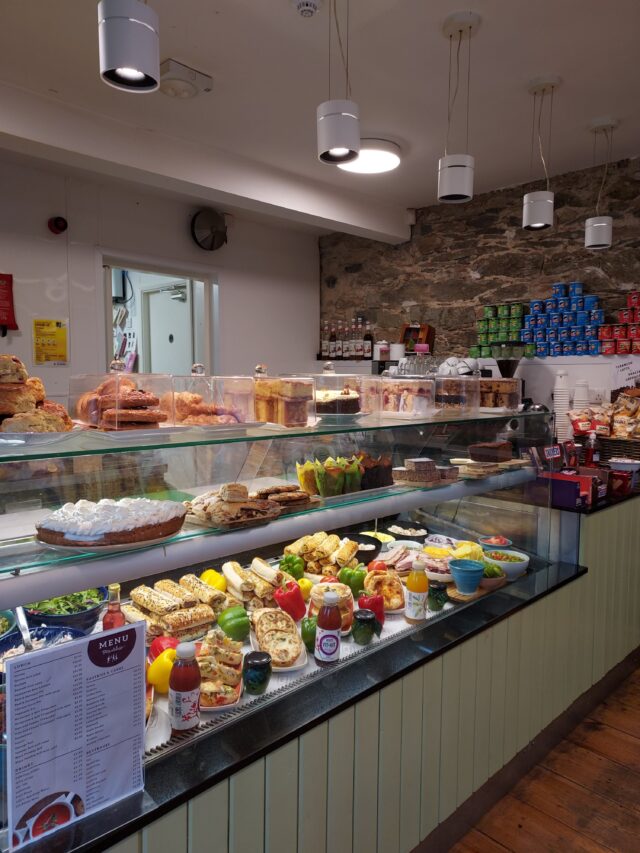 Counter stockedfull of foods at a café