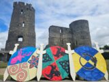 Wooden handmade Viking and warrior shields in front of Ferms Castle