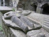 a tomb containing carvings on top of it of a knight and his wife