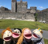 4 Puppets in front of Cahir Castle .