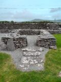 the square stone ruins of the remainder of monastic huts