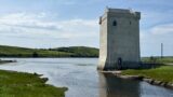 Castle surrounded by water and land