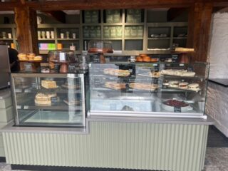 couner in a cafe with cakes and treats
