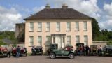 Display of Model T cars in front of Annes Grove House