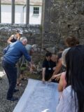 People standing in an old castle