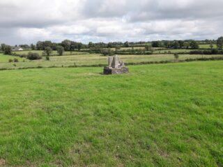 distant view of the cross fragments and the field surrounding them