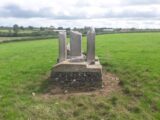 the cross fragments and the stone plinth they sit on