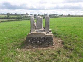 the cross fragments and the stone plinth they sit on
