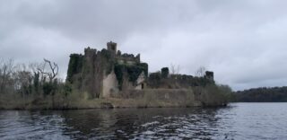 view of the outside façade of the castle from the water