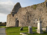 the remains of the roofless church within a graveyard