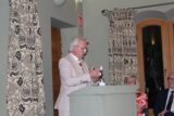 A man stands at a podium giving a talk.