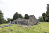the roofless church ruins within a graveyard