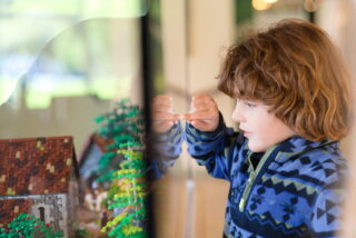 Little boy enjoying the Lego exhibition at Glendalough