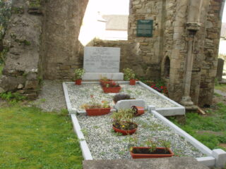 grave within the interior of the church ruins