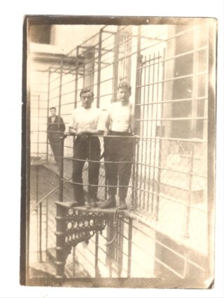 A group of prisoners posturing at the top of the spiral staircase in the East Wing of Kilmainham Goal in 1921.