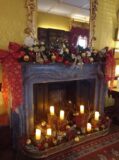 A fireplace decorated for Christmas