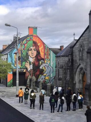 a mural depicting both sides of Brigit - the saint and goddess.