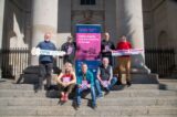 people sitting on steps outside promoting the Bealtaine festival