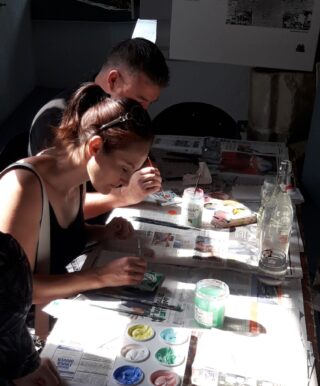 Children painting on tiles Children painting on tiles