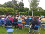 A crowd pf people seated at an event