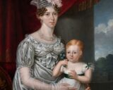 A portrait of a lady holding a little girl