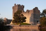 A castle in the background of water