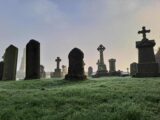 misty view of the gravestones at the rock of cashel