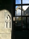 A carved stone with a window in the background