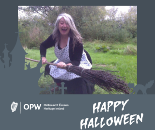 a woman dressed as a witch, holding a broom is laughing at the camera