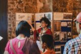 a guide giving a tour to a group