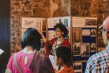 A tour Guide and soome tour attendees